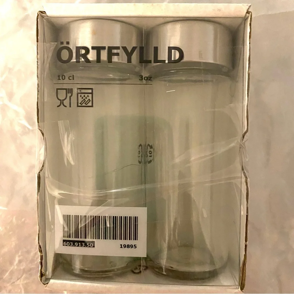 NWT Salt & Pepper Shakers Glass and Stainless Steel top.